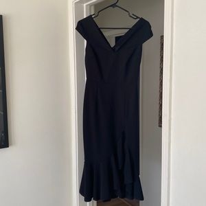 Little Black Dress!Fitted with off the shoulder sleeves and tasteful slit.